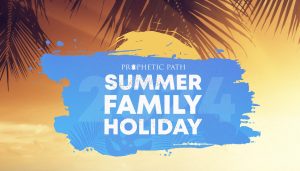 Summer Family holiday logo in blue with the sun above it in yellow. In the background palm leaves and a sunset with light clouds